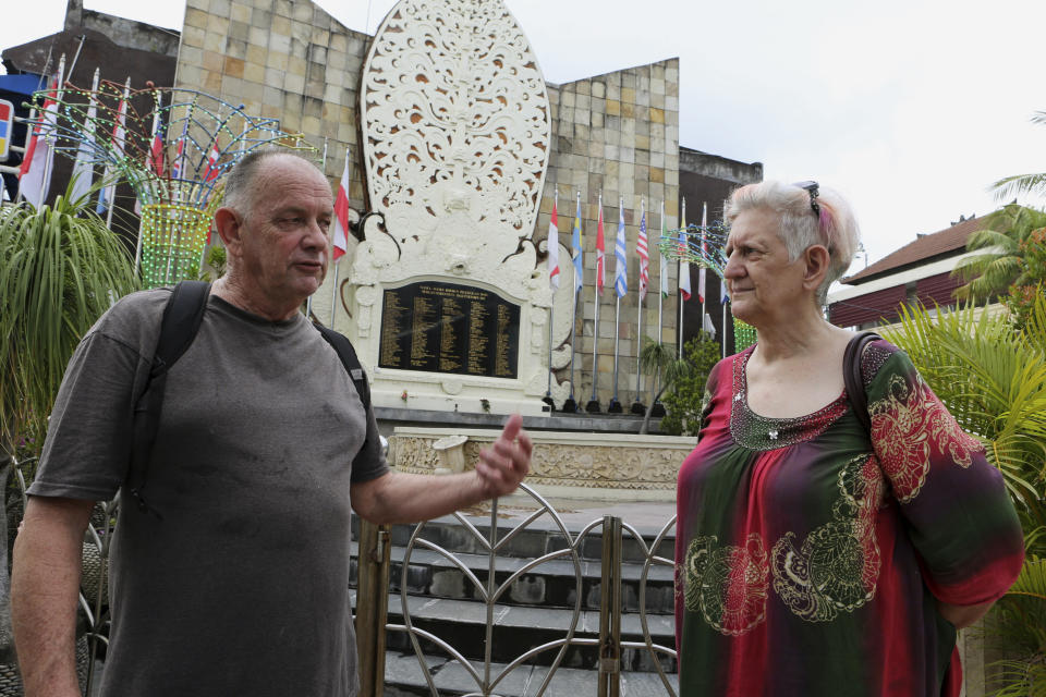 Australian tourists Gerry and Selina Dunstan visit the Bali Bombing Memorial Monument in Kuta, Bali, Indonesia on Oct. 4, 2022. Two decades after a few Bali bombings, counterterrorism efforts in the world's most populous Muslim country remain highly active. More than 2,300 people have been arrested on terrorism charges, according to data from the Center for Radicalism and Deradicalization Studies, since a national counterterrorism unit, known as Densus 88, was established in the wake of the attacks. (AP Photo/Firdia Lisnawati)