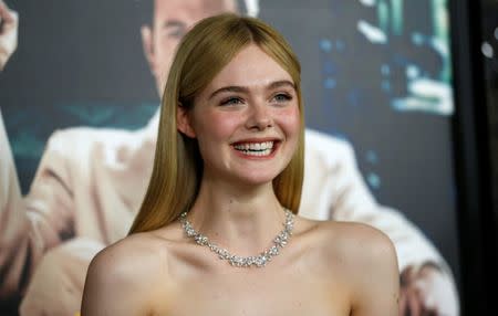 Cast member Elle Fanning poses at the premiere of "Live by Night" in Hollywood, Los Angeles, California U.S., January 9, 2017. Picture taken January 9, 2017. REUTERS/Mario Anzuoni