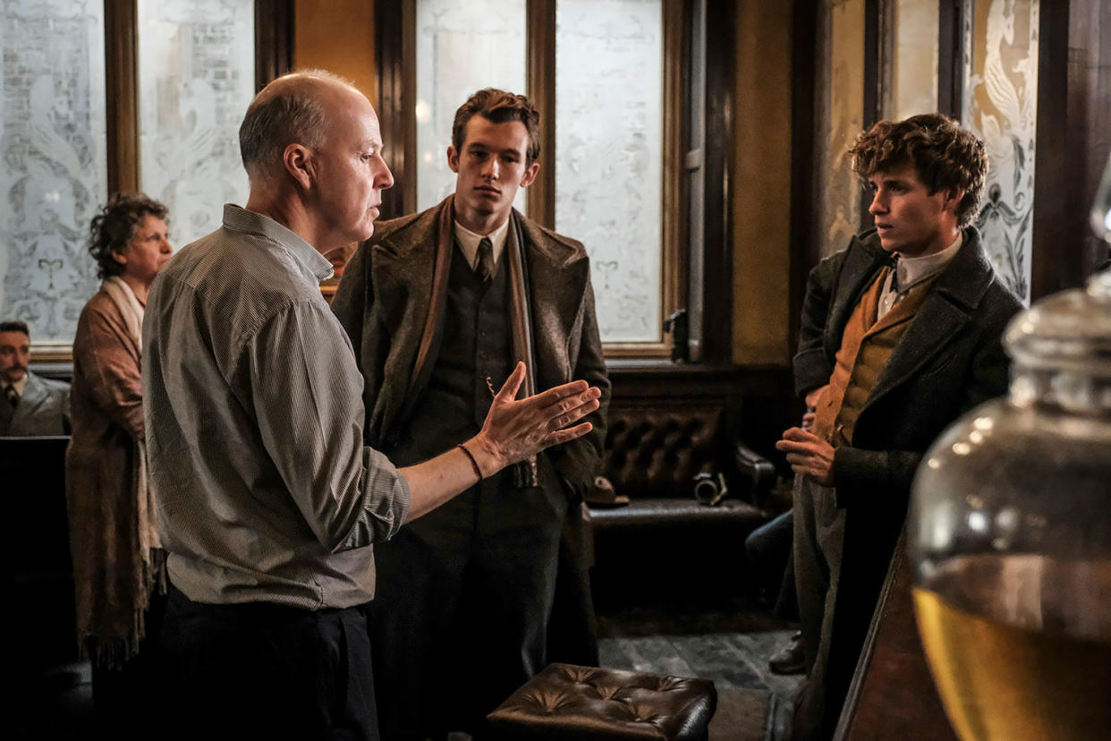 (L-r) Director David Yates, Callum Turner and Eddie Redmayne on the set of Warner Bros. Pictures’ fantasy adventure <i>Fantastic Beasts: The Crimes of Grindelwald</i>, a Warner Bros. Pictures release. (Photo by Jaap Buitendijk)