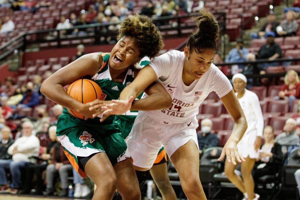 Florida State Seminoles forward Erin Howard (14) gets tangled up with a defender when going for the rebound. The Florida State Seminoles hosted the Miami Hurricanes for a women's basketball game at the Tucker Civic Center on Thursday, Jan. 20, 2022.