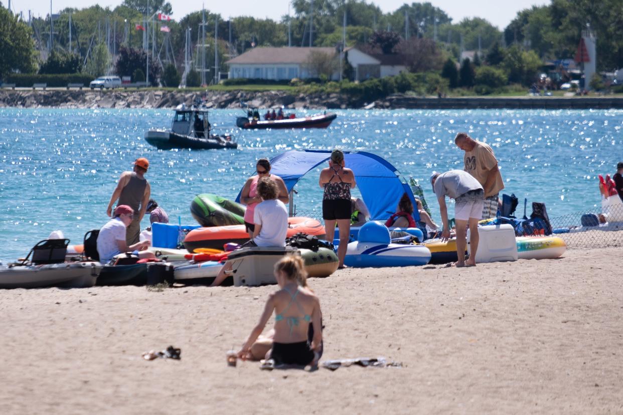 First responders patrol off the beach before Float Down at Lighthouse Beach in Port Huron.