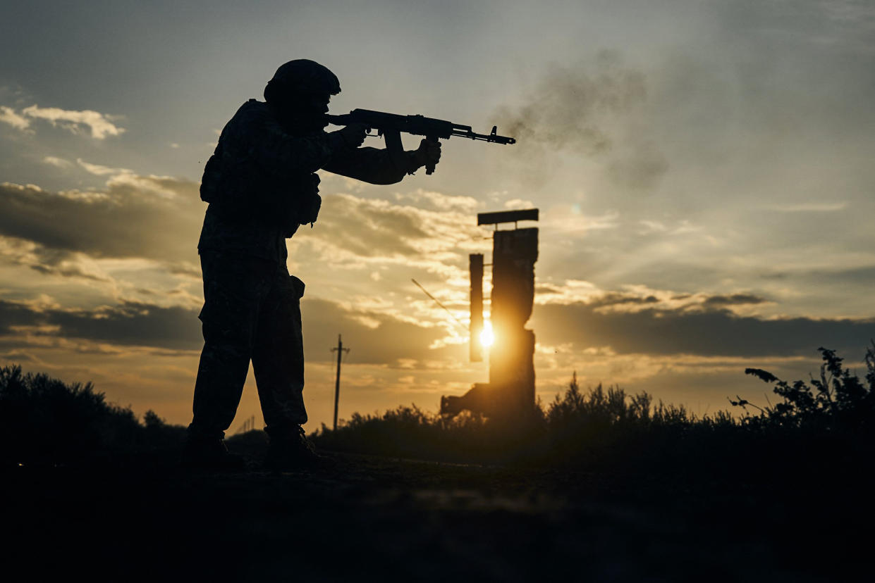 A Ukrainian soldier shoots close to Izium, Kharkiv region, on Sept. 13, 2022. (Kostiantyn Liberov / AP)