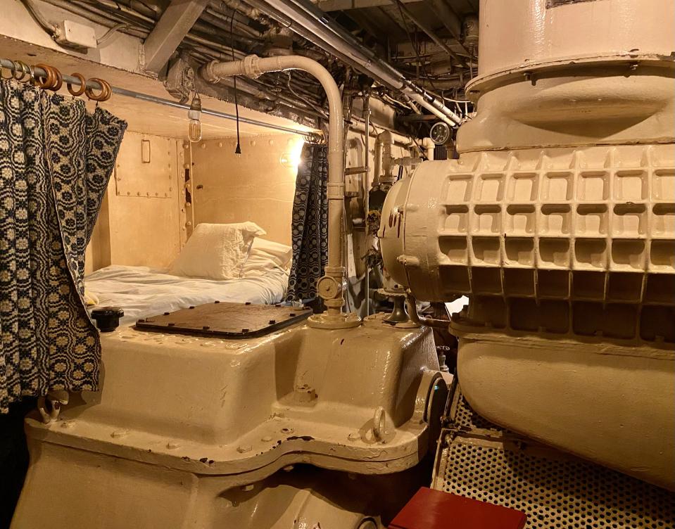 A bed next to the boat's engine.