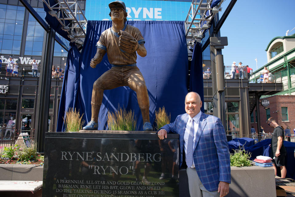 CHICAGO, IL - JUNE 23:  Former Chicago Cubs player and Hall of Famer Ryne Sandberg poses for a picture next to his statue during a statue dedication ceremony at Wrigley Field on June 23, 2024 in Chicago, Illinois.  (Photo by Jamie Sabau/Getty Images)