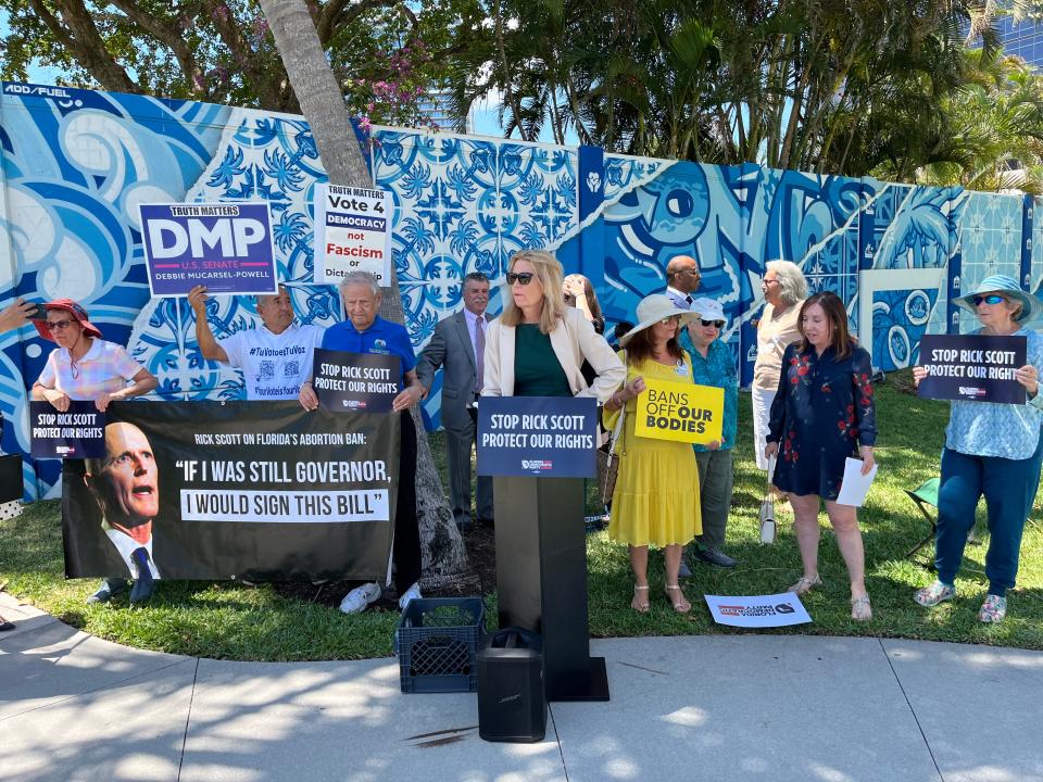 Florida state Rep. Katherin Waldron (D-Wellington), with fellow democrats, prepares to speak about women's right to abortion and Republican U.S. Sen. Rick Scott's opposition to it, on Thursday at Flagler Park in West Palm Beach.