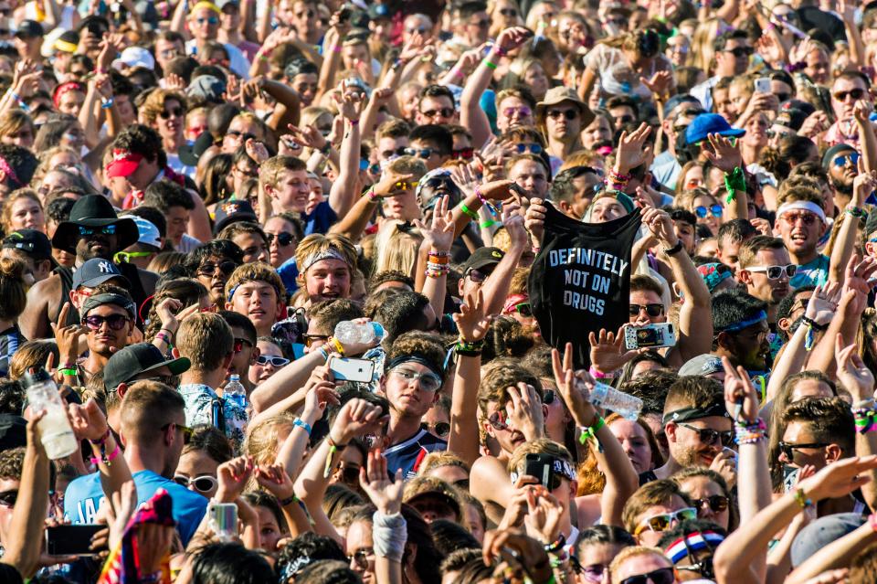 Festival goers attend day two of Lollapalooza in Grant Park on Friday, Aug. 2, 2019, in Chicago. (Photo by Amy Harris/Invision/AP) ORG XMIT: ILAH169