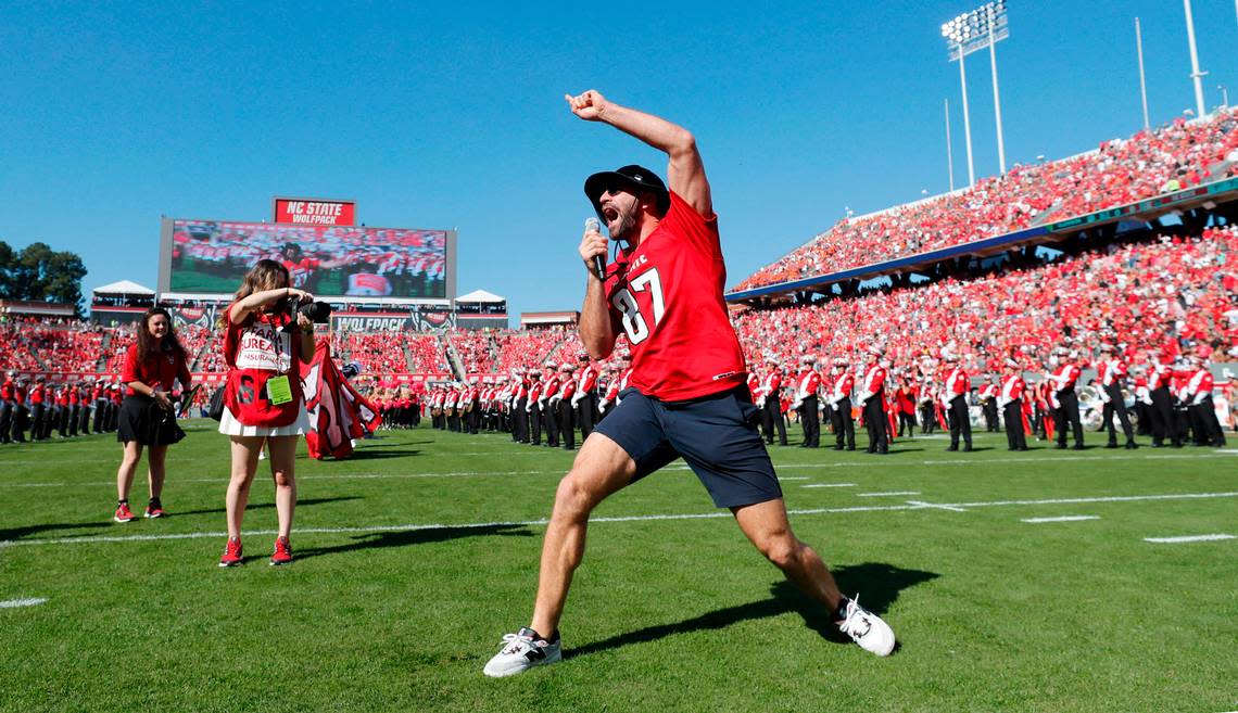 The Carolina Hurricanes’ Jordan Martinook leads a Wolfpack chant before N.C. State’s game against Clemson at Carter-Finley Stadium in Raleigh, N.C., Saturday, Oct. 28, 2023. Ethan Hyman/ehyman@newsobserver.com