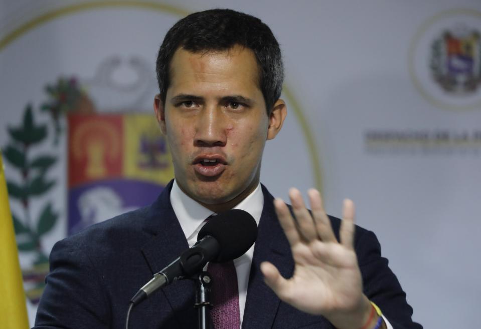 Venezuela's National Assembly President and self-proclaimed interim President Juan Guaido speaks to the press in Caracas, Venezuela, Monday, Sept. 16, 2019. A group of minority opposition parties in Venezuela agreed Monday to enter negotiations with President Nicolas Maduro's government without the consent of the U.S.-backed opposition leader. (AP Photo/Ariana Cubillos)
