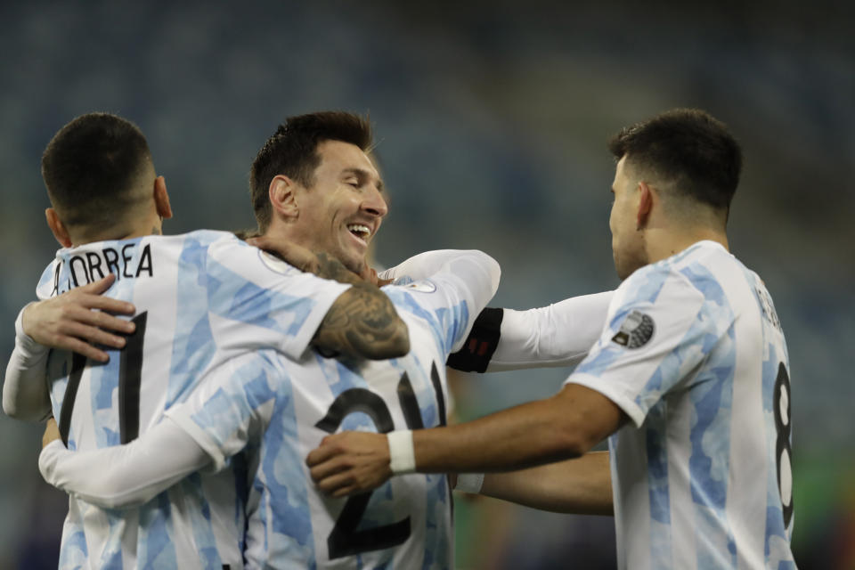 Argentina's Alejandro Gomez, center left, celebrates scoring the opening goal against Bolivia with teammates Lionel Messi, center right, Marcos Acuna, right, and Angel Correa during a Copa America soccer match at Arena Pantanal stadium in Cuiaba, Brazil, Monday, June 28, 2021. (AP Photo/Bruna Prado)