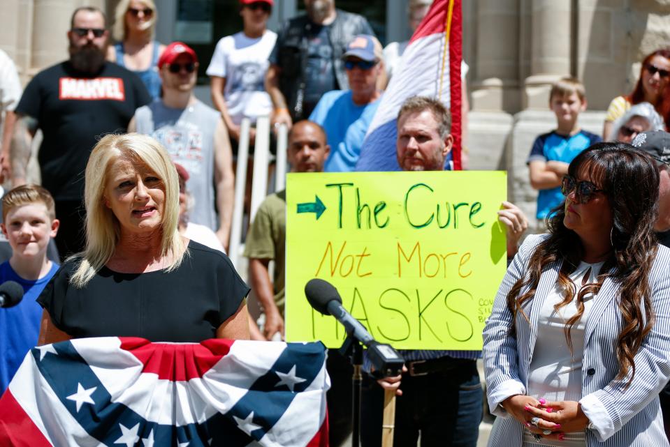 Rachel Shelton speaks at a press conference with her lawyer Kristi Fulnecky (right) outside Historic City Hall announcing a lawsuit against the City of Springfield seeking a temporary restraining order and injunction against the mask ordinance on Thursday, July 23, 2020.