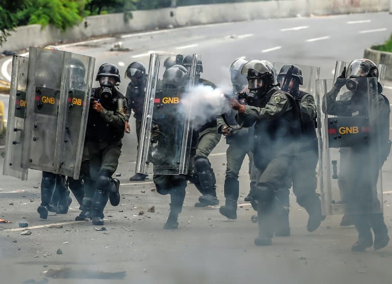 National Guard fire tear gas at opposition activists during a protest against Venezuelan President Nicolas Maduro, in Caracas