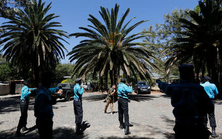 Chinese national Jack Wang, a security trainer at the Chinese-run Deway Security Group leads Kenyan security guards in martial arts combat training at their company compound in Kenya's capital Nairobi, March 13, 2017. REUTERS/Thomas Mukoya