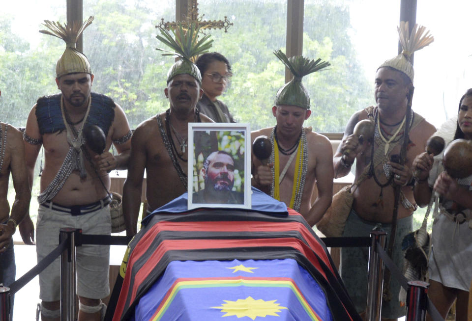 Xucuru Indigenous attend the funeral of Indigenous expert Bruno Pereira at the Morada da Paz cemetery, Recife, Pernambuco state, Friday, June 24, 2022. Indigenous groups, family and friends paid their final respects on Friday to Pereira who was killed in the Amazon region with the British journalist Dom Phillips. (AP Photo/Teresa Maia)