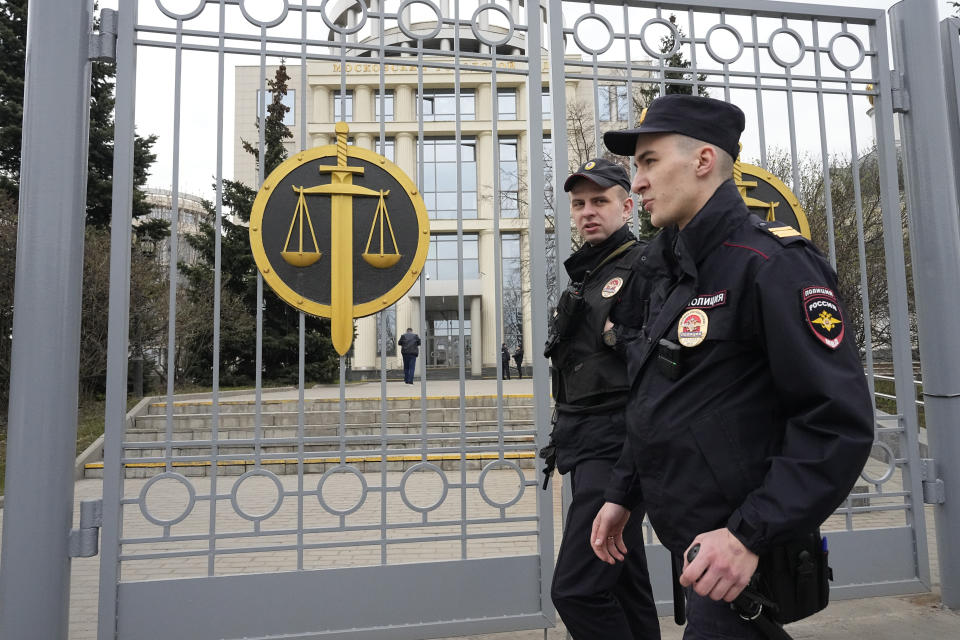 Police officers guard the Moscow City Court entrance prior to sentencing of Russian opposition activist Vladimir Kara-Murza, in Moscow, Russia, Monday, April 17, 2023. A top Kremlin foe was convicted Monday on charges of treason and denigrating the Russian military and sentenced him to 25 years in prison after a trial that marked the latest move in a relentless crackdown on the opposition amid the fighting in Ukraine. (AP Photo/Alexander Zemlianichenko)
