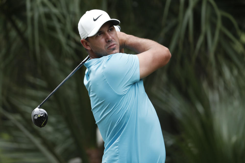 Brooks Koepka hits from the 11th tee during the first round of the RBC Heritage golf tournament, Thursday, June 18, 2020, in Hilton Head Island, S.C. (AP Photo/Gerry Broome)