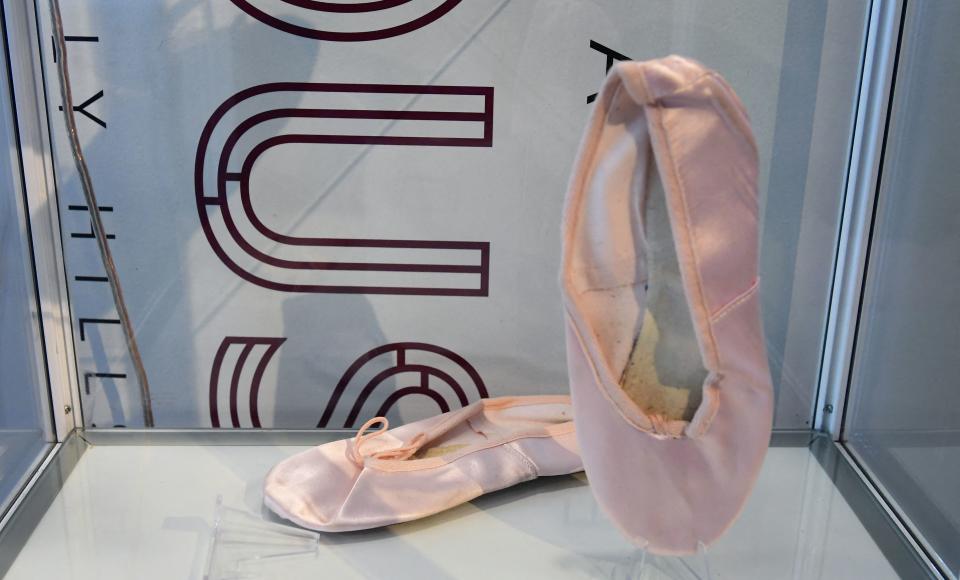 Petal pink satin ballet slippers worn by Amy Winehouse, who was often photographed performing in or out wearing ballet slippers, are displayed at Julien's Auctions in Beverly Hills, California on November 1, 2021, ahead of the "Property from the Life and Career of Amy Winehouse" auction to be held November 6 and 7, 2021. (Photo by Frederic J. BROWN / AFP) (Photo by FREDERIC J. BROWN/AFP via Getty Images)