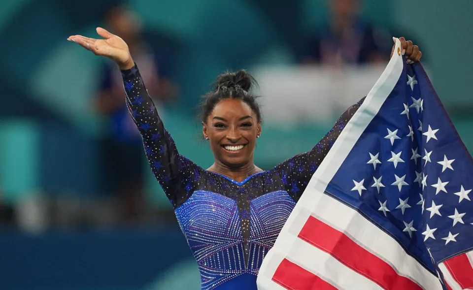 Simone Biles holds American Flag at 2024 Olympics