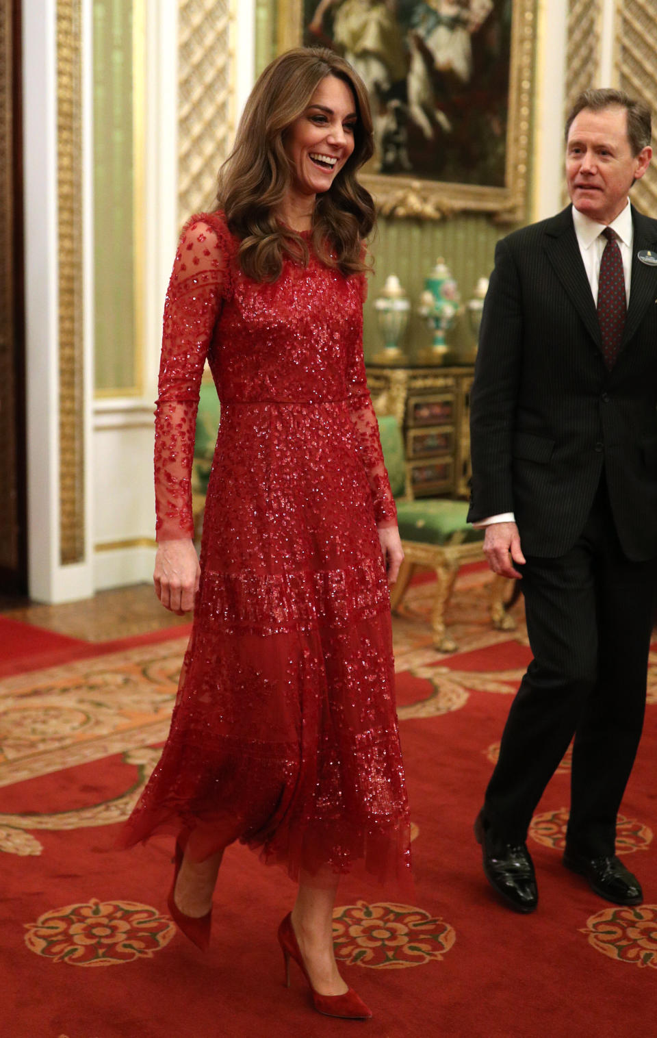 The Duchess of Cambridge walks through to the State Room with the master of the household. (Photo: WPA Pool via Getty Images)