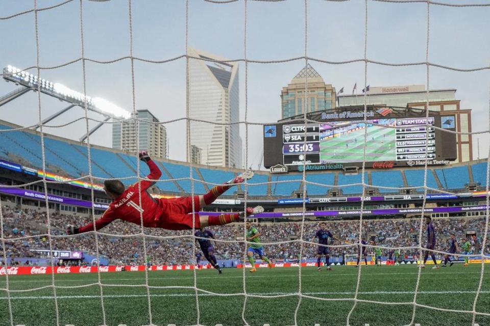 Jun 10, 2023; Charlotte, North Carolina, USA; Charlotte FC goalkeeper Kristijan Kahlina (1) dives trying to make a save against the Seattle Sounders during the second half at Bank of America Stadium. Mandatory Credit: Jim Dedmon-USA TODAY Sports