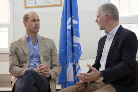 Britain's Prince William is briefed by Scott Anderson, director of United Nations Relief and Works Agency (UNRWA) operations in the West Bank, during a visit to a clinic at Jalazone refugee camp near Ramallah, in the occupied West Bank June 27, 2018. Fadi Arouri/Pool via Reuters