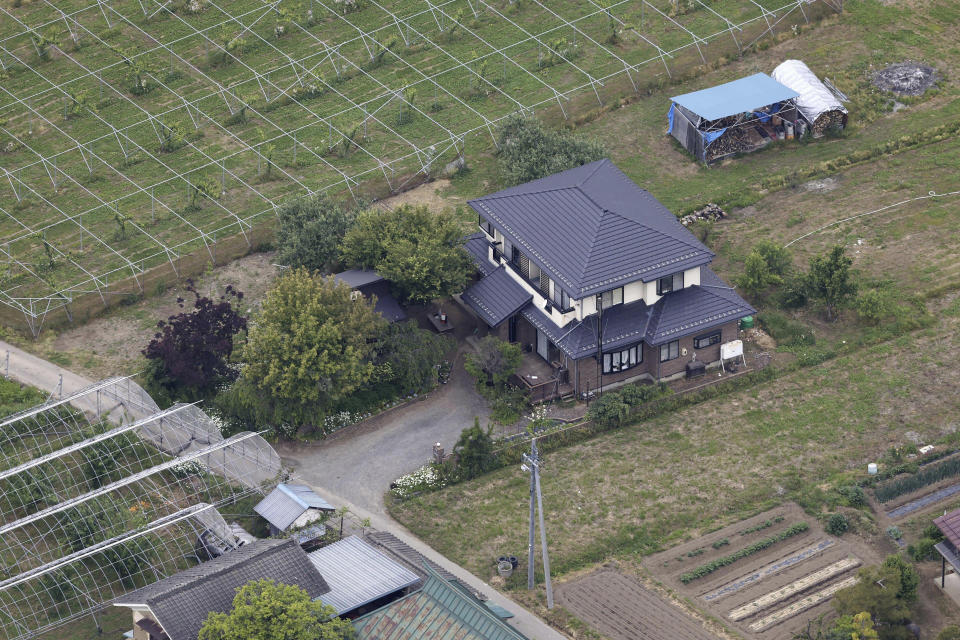 This shows a house where a man with a rifle and knife had holed up in Nakano, Nagano prefecture, central Japan Friday morning, May 26, 2023. Police said that they arrested the man armed with a rifle and a knife who had holed up inside the house for hours after allegedly killing four people, including two police officers. (Kyodo News via AP)