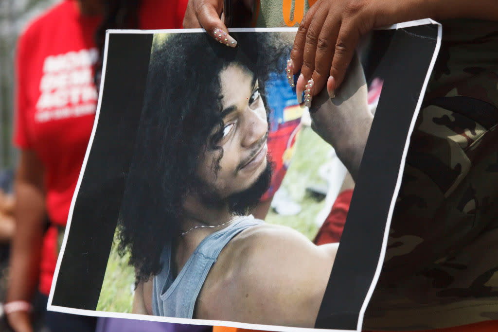 A Black Lives Matter activist holds a picture of Casey Goodson Jr. during the July 31, 2021 march and rally in Columbus, Ohio. (Photo by Stephen Zenner/SOPA Images/LightRocket via Getty Images)