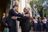 <p>European Commission President Jean-Claude Juncker, right, is welcomed by Spain’s Prime Minister Pedro Sanchez at the Carlos Amberes foundation in Madrid, Thursday, July 19, 2018. (AP Photo/Francisco Seco) </p>