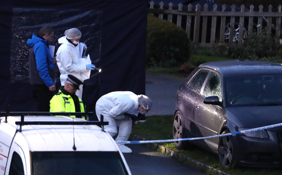 Police combing the crime scene for evidence. (PA)