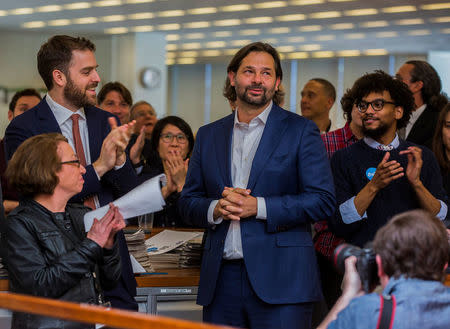 L-R; Michele McNally, assistant editor and director of photography of The New York Times; David Furst, international picture editor; photojournalist Daniel Berehulak, celebrate the announcement of the 2017 Pulitzer Prizes in The Times newsroom, in New York, U.S., April 10, 2017. Hiroko Masuike/Courtesy The New York Times/Handout via REUTERS