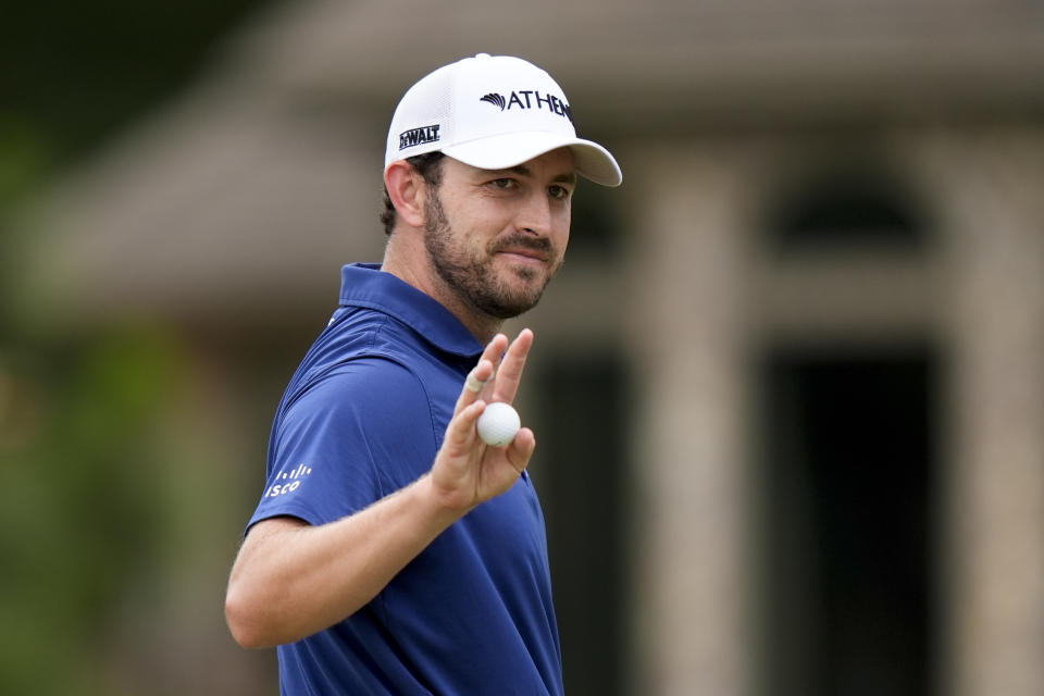 Patrick Cantlay waves after making a putt on the ninth hole during the first round of the U.S. Open golf tournament Thursday, June 13, 2024, in Pinehurst, N.C. (AP Photo/Frank Franklin II )