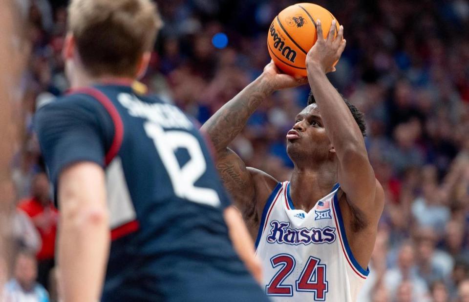 Kansas Jayhawks forward K.J. Adams Jr. (24) shoots a free throw during an NCAA basketball game against the Connecticut Huskies on Friday, Dec. 1, 2023, in Lawrence, Kan. Nick Wagner/nwagner@kcstar.com