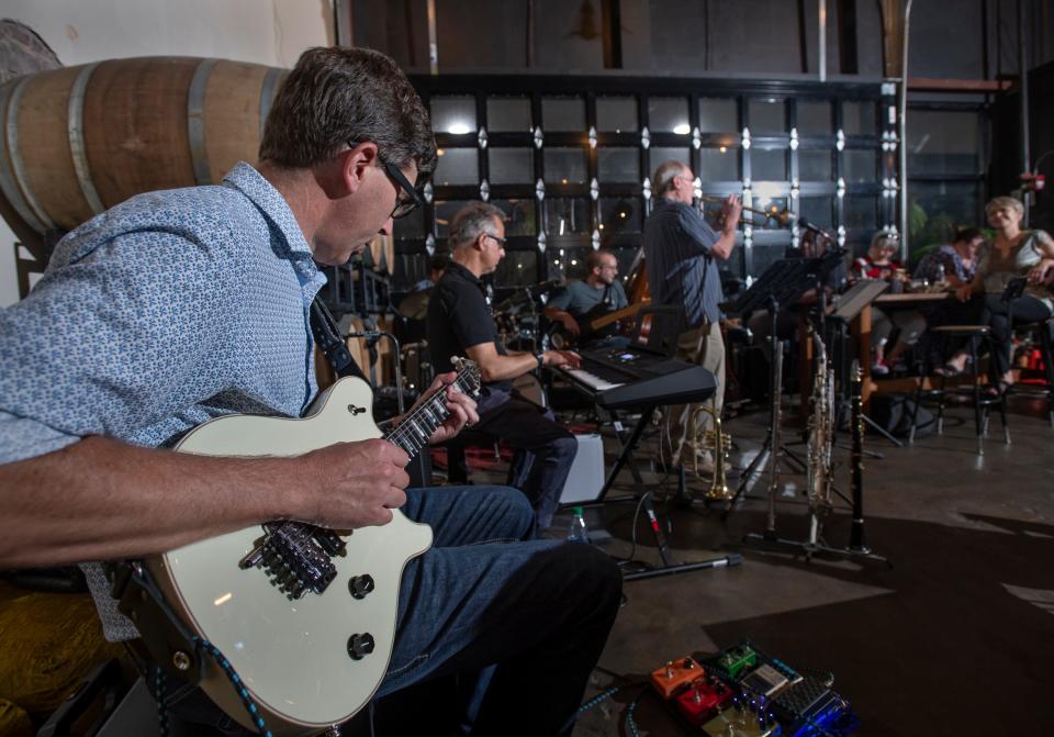 From left, guitarist Jim Green, keyboardist George Petro, bassist Max Levesque, and trumpeter Roger Villines perform with fellow musicians during Jazz Pensacola's August Jazz Jam at Odd Colony Brewing Company in Pensacola on Wednesday, Aug. 3, 2022.