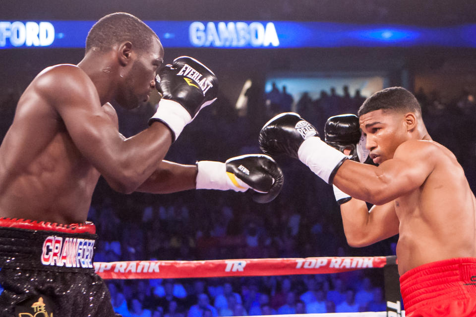 Terence Crawford’s hard-fought win over Yuriorkis Gamboa (R) in June 2014 made him a star. (AP Photo)