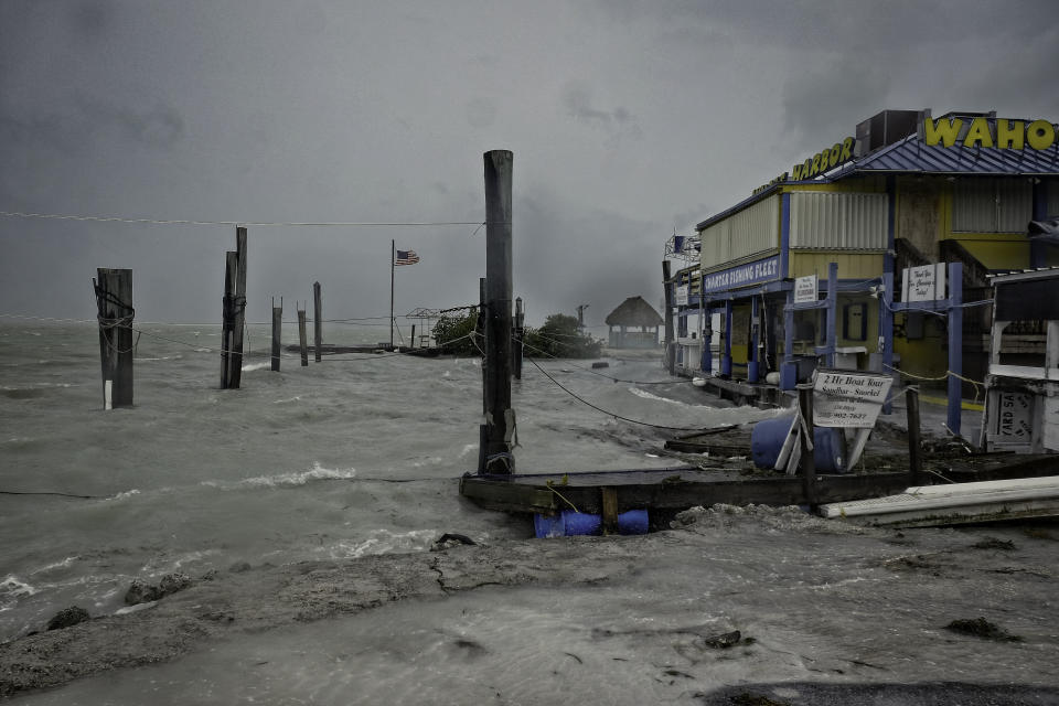 <p>Rough surf churned up buy the approaching hurricane damage the docks at Whale harbor in the Florida Keys as winds and rain from the outer bands of Hurricane Irma arrive in Islamorada, Fla., on Sept. 9, 2017. (Photo: Gaston De Cardenas/AFP/Getty Images) </p>