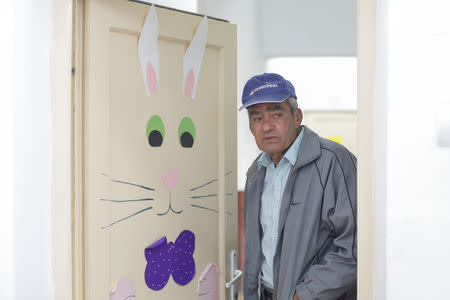 A man enters a polling station in Gaiseni, Romania October 7, 2018. Inquam Photos/Octav Ganea via REUTERS