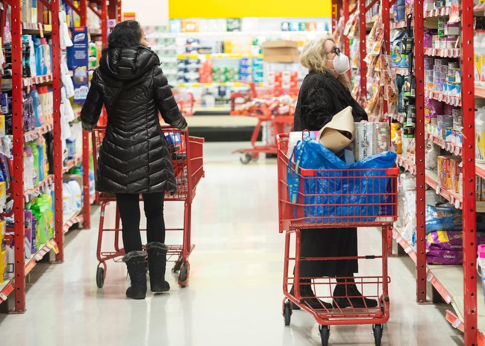 People shop in a grocery store in Montreal in November 2022. Canada's annual inflation rate slowed to 2.8 per cent in February, according to Statistics Canada. (Graham Hughes/The Canadian Press - image credit)