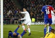 Real Madrid's Cristiano Ronaldo (C) celebrates after scoring a goal during their Champions League Group B soccer match against FC Basel at St. Jakob-Park stadium in Basel November 26, 2014. REUTERS/Ruben Sprich