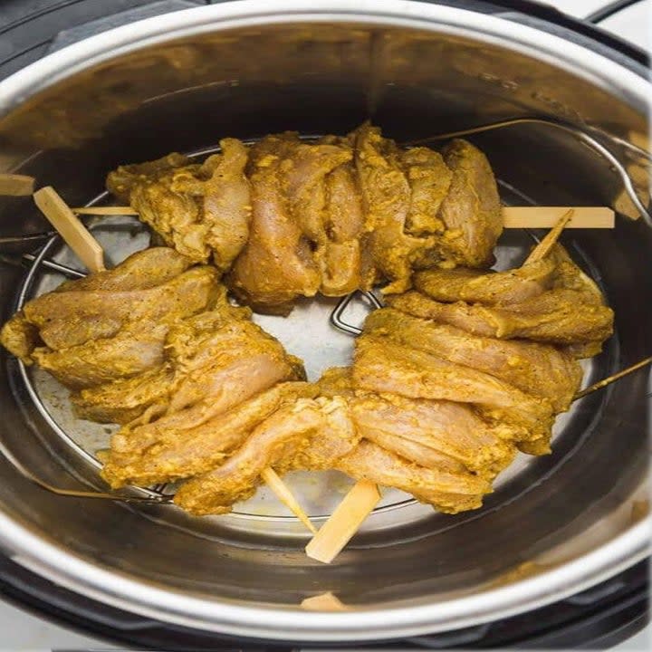 Marinated chicken shawarma on skewers in an Instant Pot