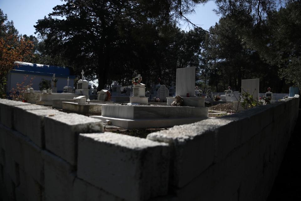 A cuddly toy is placed on the grave of a five-year boy from Afghanistan, at Iraion village, on the eastern Aegean island of Samos, Greece, Monday, Feb. 22, 2021. On a hill above a small island village, the sparkling blue of the Aegean just visible through the pine trees, lies a boy’s grave. His first ever boat ride was to be his last - the sea claimed him before his sixth birthday. His 25-year-old father, like so many before him, had hoped for a better life in Europe, far from the violence of his native Afghanistan. But his dreams were dashed on the rocks of Samos, a picturesque Greek island almost touching the Turkish coast. Still devastated from losing his only child, the father has now found himself charged with a felony count of child endangerment. (AP Photo/Thanassis Stavrakis)