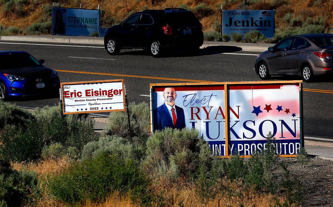 A pair of political signs for the two candidates running for the Benton County prosecutor are close to one another near the Steptoe roundabout in Richland.