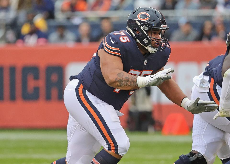 CHICAGO, ILLINOIS – OCTOBER 31: Larry Borom #75 of the Chicago Bears moves to block against the <a class="link " href="https://sports.yahoo.com/nfl/teams/san-francisco/" data-i13n="sec:content-canvas;subsec:anchor_text;elm:context_link" data-ylk="slk:San Francisco 49ers;sec:content-canvas;subsec:anchor_text;elm:context_link;itc:0">San Francisco 49ers</a> at Soldier Field on October 31, 2021 in Chicago, Illinois. The 49ers defeated the Bears 33-22. (Photo by Jonathan Daniel/Getty Images)