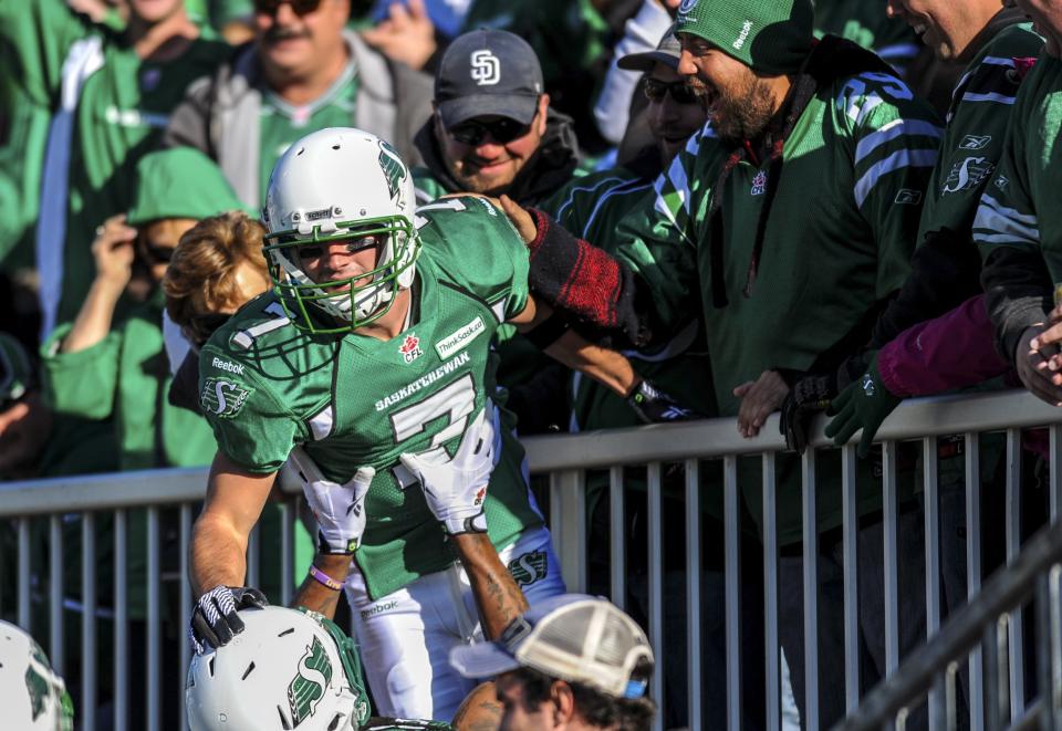 Saskatchewan Roughriders slotback Weston Dressler celebrates with the crowd after scoring a touchdown during the first half of their CFL football game against the Edmonton Eskimos in Regina, Saskatchewan October 12, 2013. REUTERS/Matt Smith (CANADA - Tags: SPORT FOOTBALL)