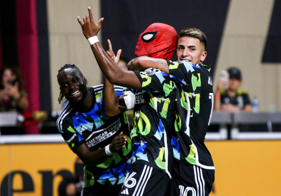 Nov 7, 2023; Atlanta, Georgia, USA; Atlanta United forward
Xande Silva (16) celebrates as Spiderman with teammates after scoring a goal in the first half against Columbus Crew at Mercedes-Benz Stadium. Mandatory Credit: Brett Davis -USA TODAY Sports