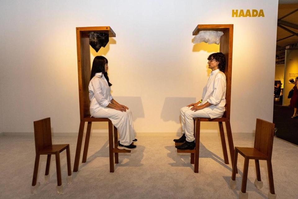 Two models sit in Maria Abravanic’s “Chairs for Human and Spirit Use” during the VIP opening of Design Miami in Miami Beach. D.A. Varela/dvarela@miamiherald.com