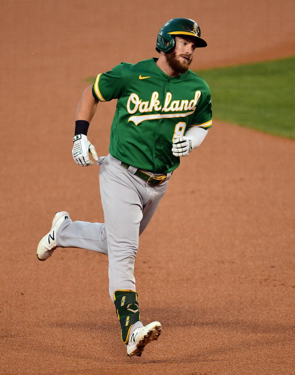 Oakland Athletics left fielder Robbie Grossman rounds the bases after hitting a solo home run against the Los Angeles Dodgers at Dodger Stadium, Sept. 22, 2020.