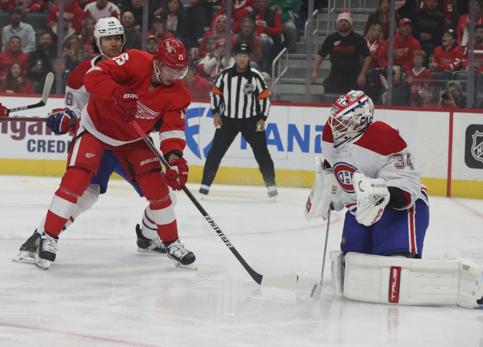 Detroit Red Wings left wing Jakub Vrana takes a shot against Montreal Canadiens goaltender Jake Allen.