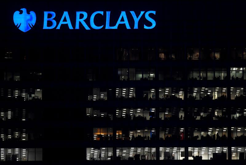 FILE PHOTO: Workers are seen at Barclays bank offices in the Canary Wharf financial district in London