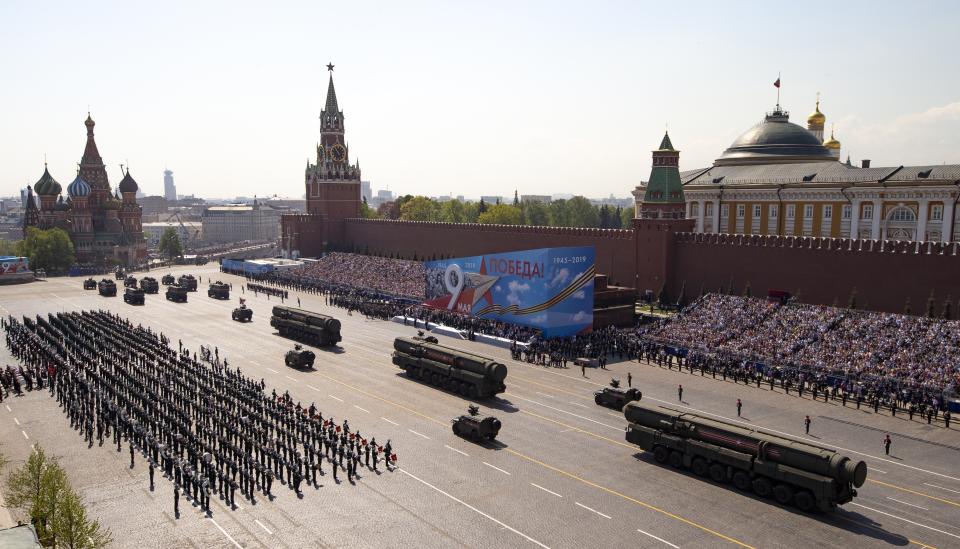 FILE - Russian military vehicles roll down Red Square Red Square during a rehearsal for the Victory Day military parade in Moscow, Russia, on May 7, 2019. Some in the West think Russian President Vladimir Putin may use the Victory Day on May 9 when Russia celebrates the defeat of Nazi Germany in World War II to officially declare that war is underway in Ukraine and announce a mobilization _ the claim rejected by the Kremlin. (AP Photo/Alexander Zemlianichenko, Pool, File)