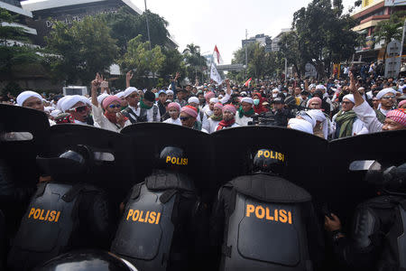 People protest outside the Elections Supervisory Agency (Bawaslu) office in Jakarta, Indonesia May 22, 2019 in this photo taken by Antara Foto. Antara Foto/Indrianto Eko Suwarso/ via REUTERS