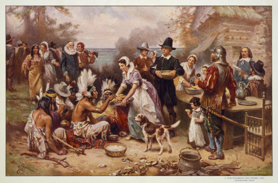 This image made available by the Library of Congress shows a reproduction of a painting by Jean Leon Gerome Ferris titled "First Thanksgiving" made between 1900-1920. Most American children grow up with the feel-good story of the Pilgrims: How Pokanoket sachem (leader) Massasoit extended the hand of friendship to the English settlers, helping them survive their first winter on these shores, and later joining them for the first Thanksgiving feast. But there is a darker side to that tale, as related by Mayflower passenger Edward Winslow in his 1624 tract, "Good Newes From New England." (J.L.G. Ferris/Library of Congress via AP)